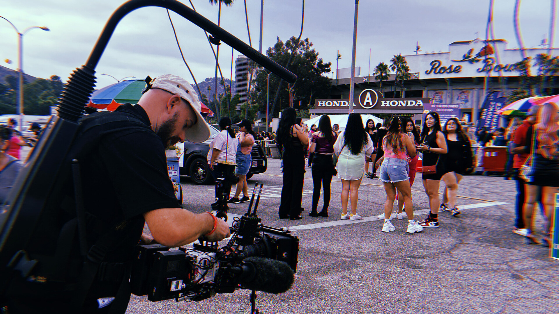 camera operator with RED KOMODO steadycam rig outside the Rose Bowl stadium