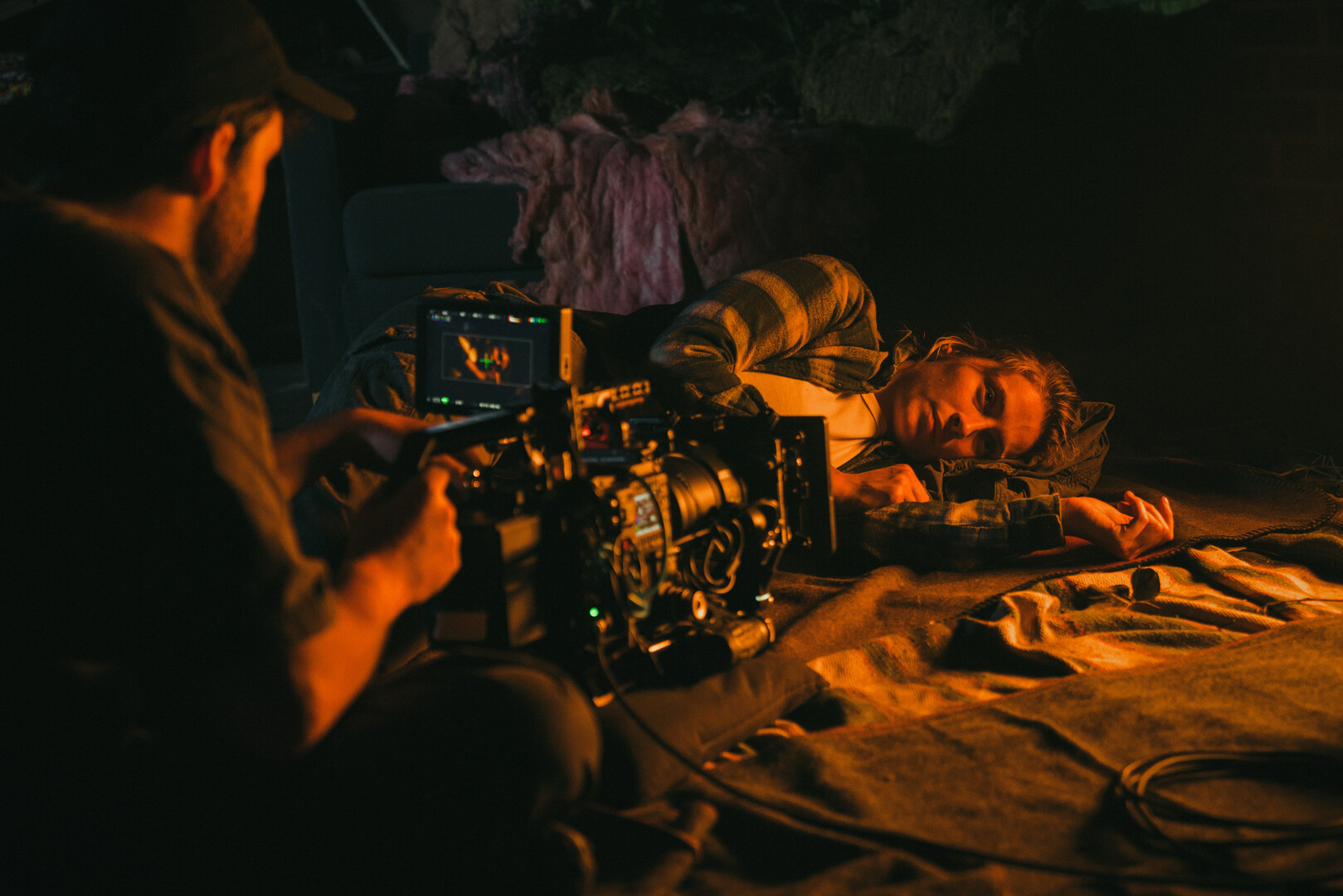 A person and person lying down on the floor