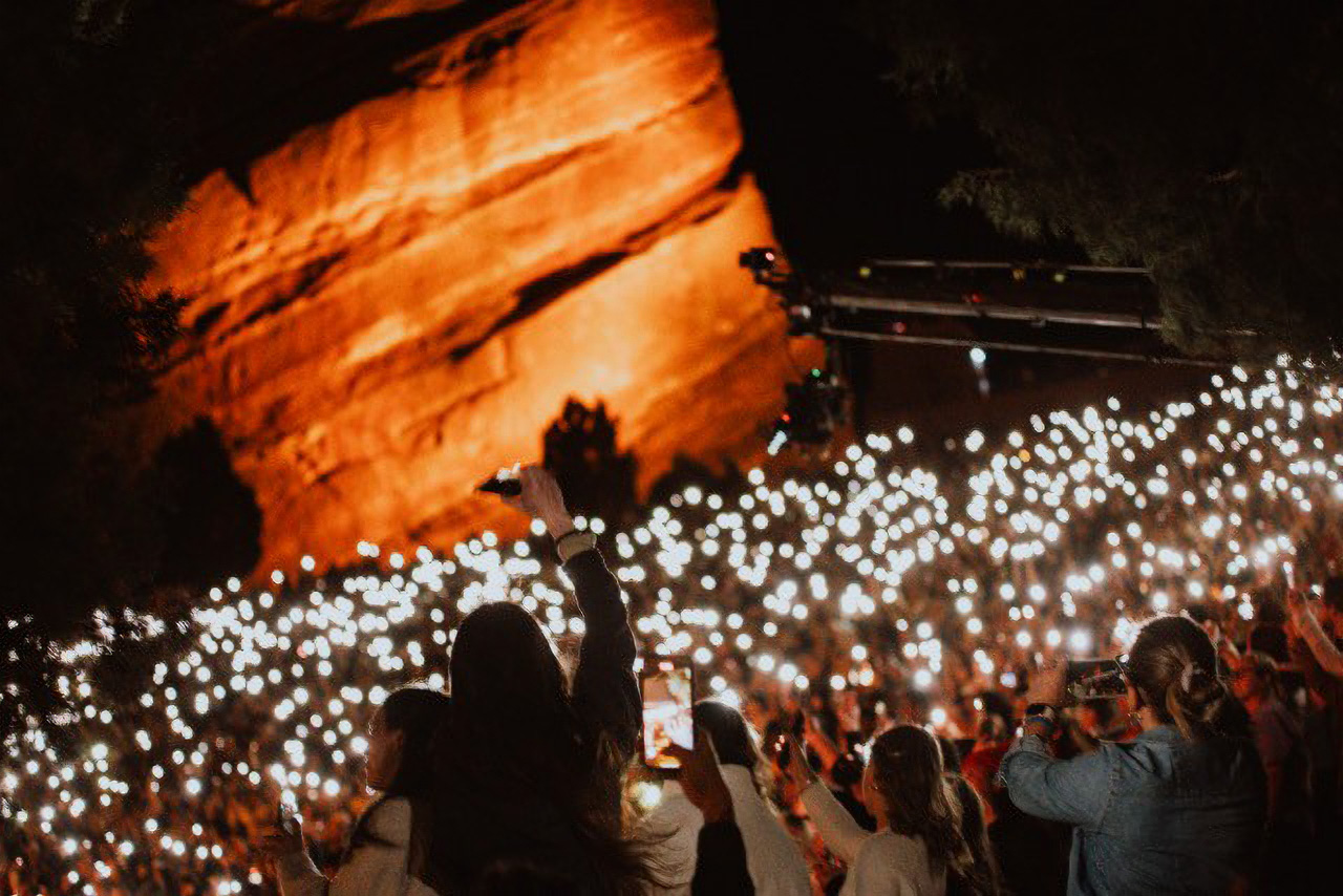 concert crowd holding LED phone lights at Red Rocks